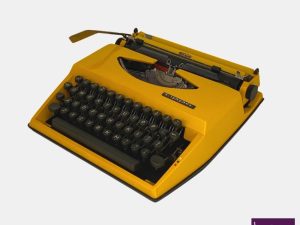 Vintage Yellow Triumph Tippa Typewriter On Latin Characters