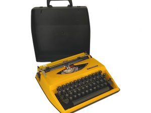 Vintage Yellow Triumph Tippa Typewriter On Latin Characters